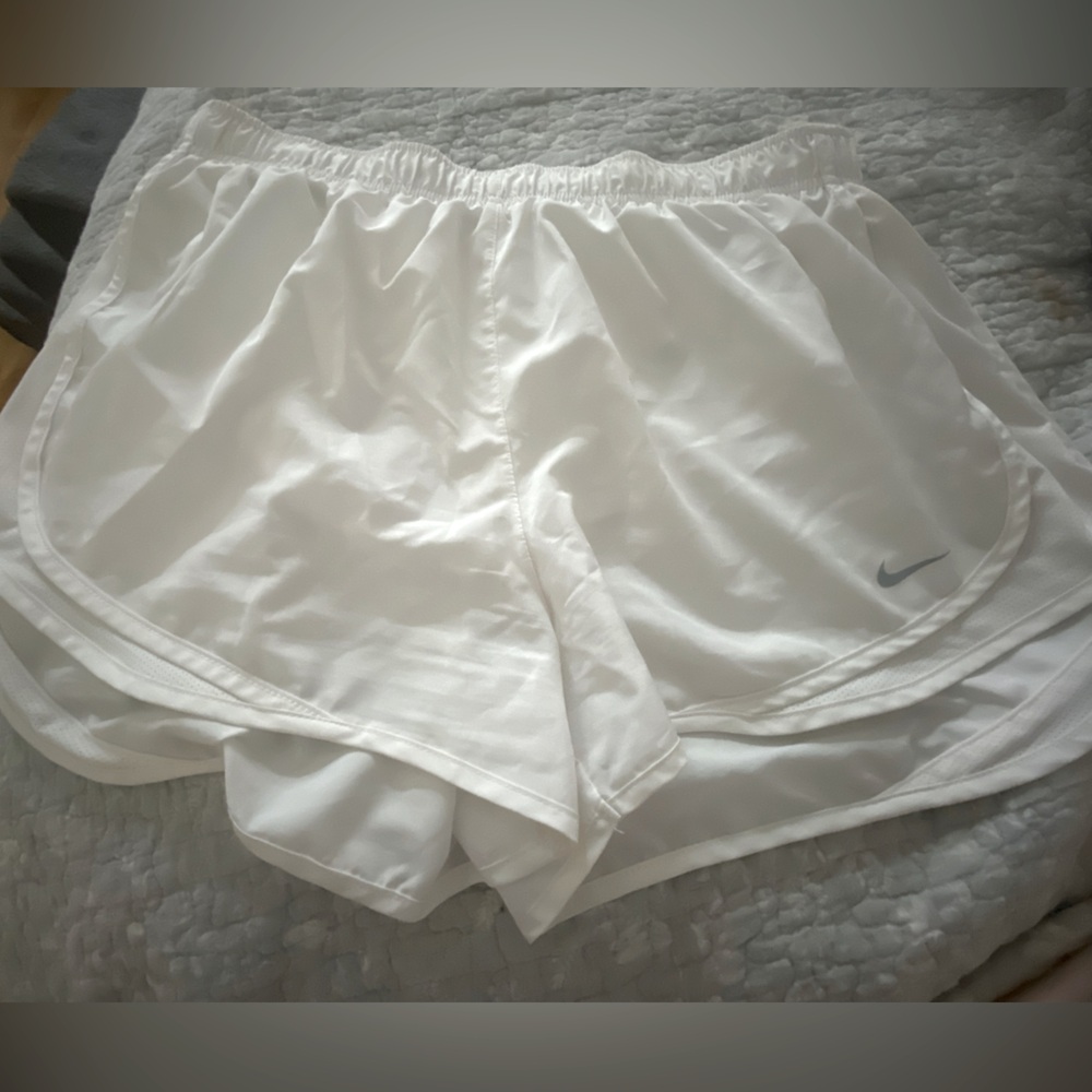 White Nike running shorts